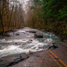 photo of road washed out by floodwaters