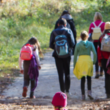 mixed age group hiking on gravel path