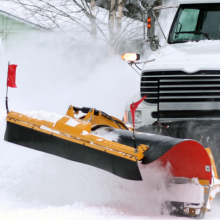 dump truck with plow in deep snow