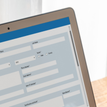 person filling out application form on the computer