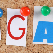 the word Engage in cut out magazine letters pinned to a cork notice board