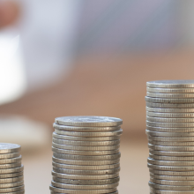 stacks of quarters that grow higher with each stack