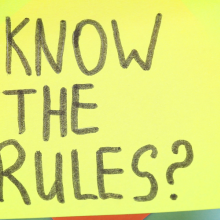 sticky note reading "Know the Rules?"
