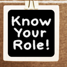 Know Your Role! A business message text written on a chalkboard