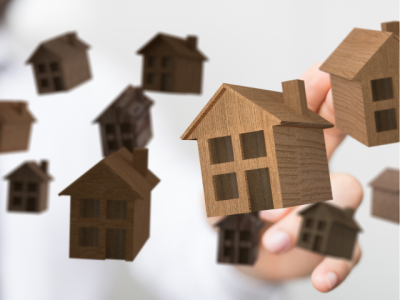 models of simple houses floating in air