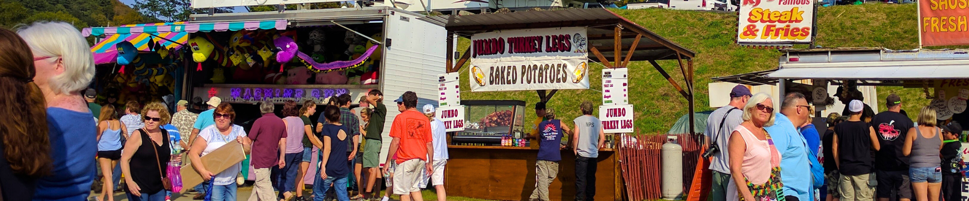 people at a modern fair eating fair food