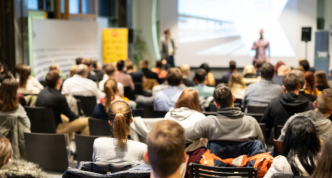 speaker presenting to audience