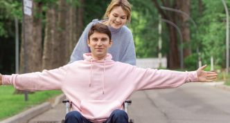 man in wheelchair celebrating outdoor access