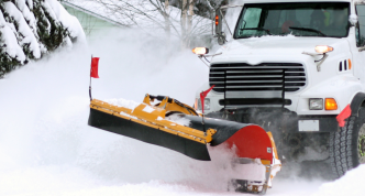 dump truck with plow in deep snow