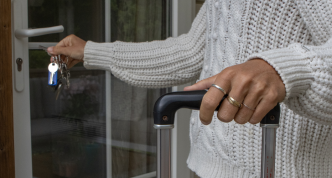 woman unlocking house door