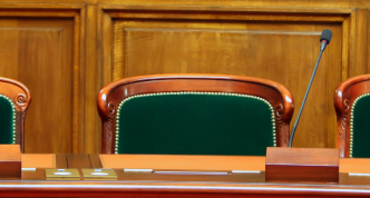 photo of three leaders' seats in a formal government hearing space