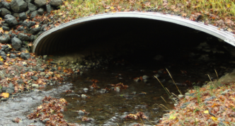 metal arch culvert with stream